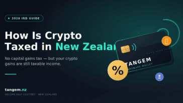 Crypto tax New Zealand 2026 — hardware wallet beside an IRD tax return